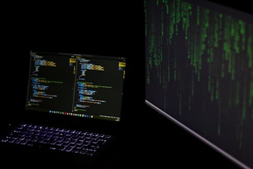 A laptop computer sitting on top of a desk