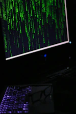 A computer monitor sitting on top of a desk