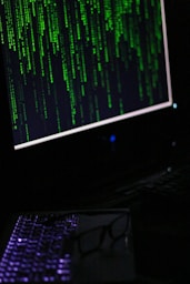 A computer monitor sitting on top of a desk