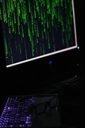A computer monitor sitting on top of a desk
