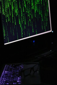 A computer monitor sitting on top of a desk