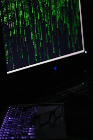 A computer monitor sitting on top of a desk