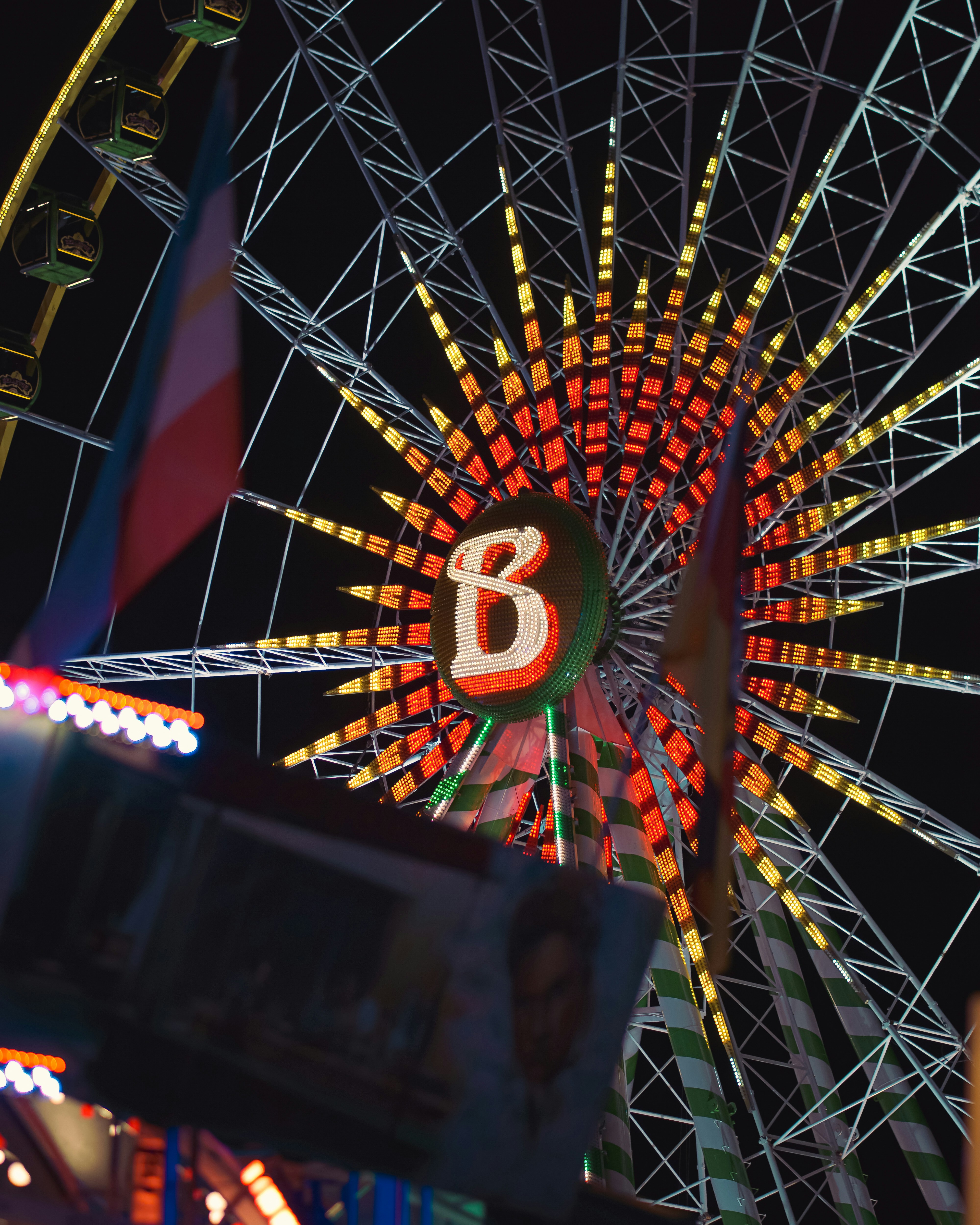 A ferris wheel at a carnival at night