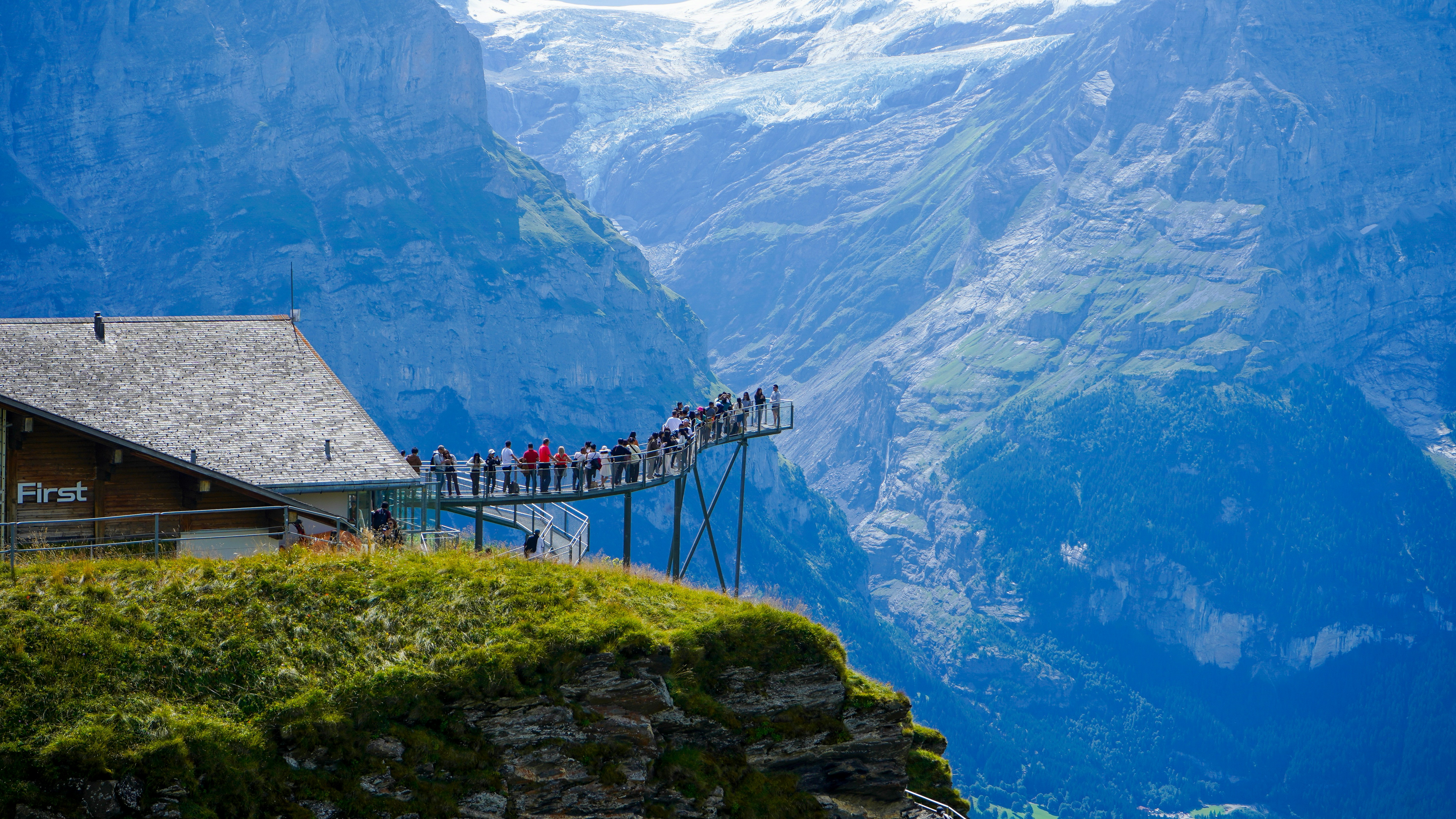 A group of people standing on top of a mountain