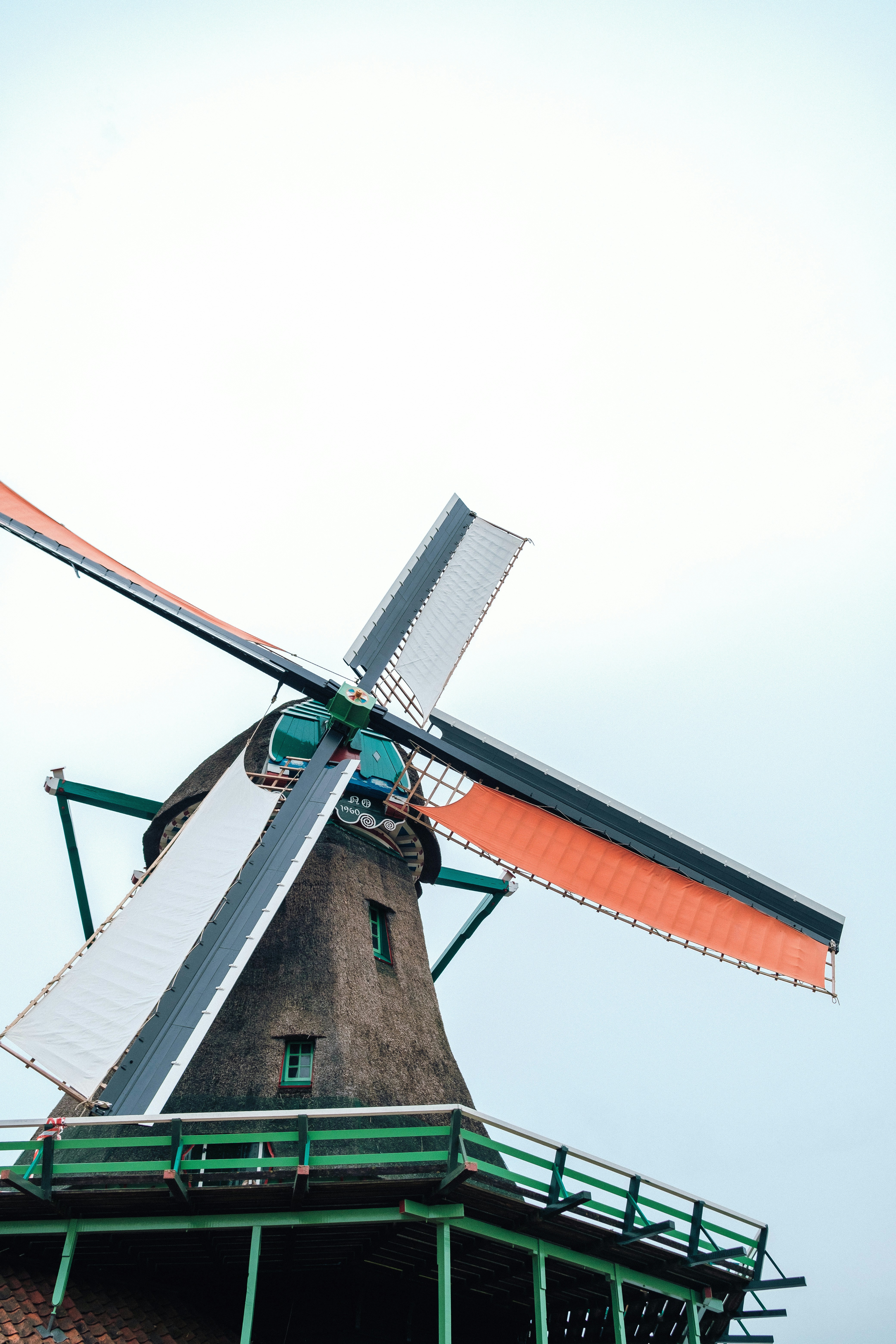 A windmill that is sitting in the grass