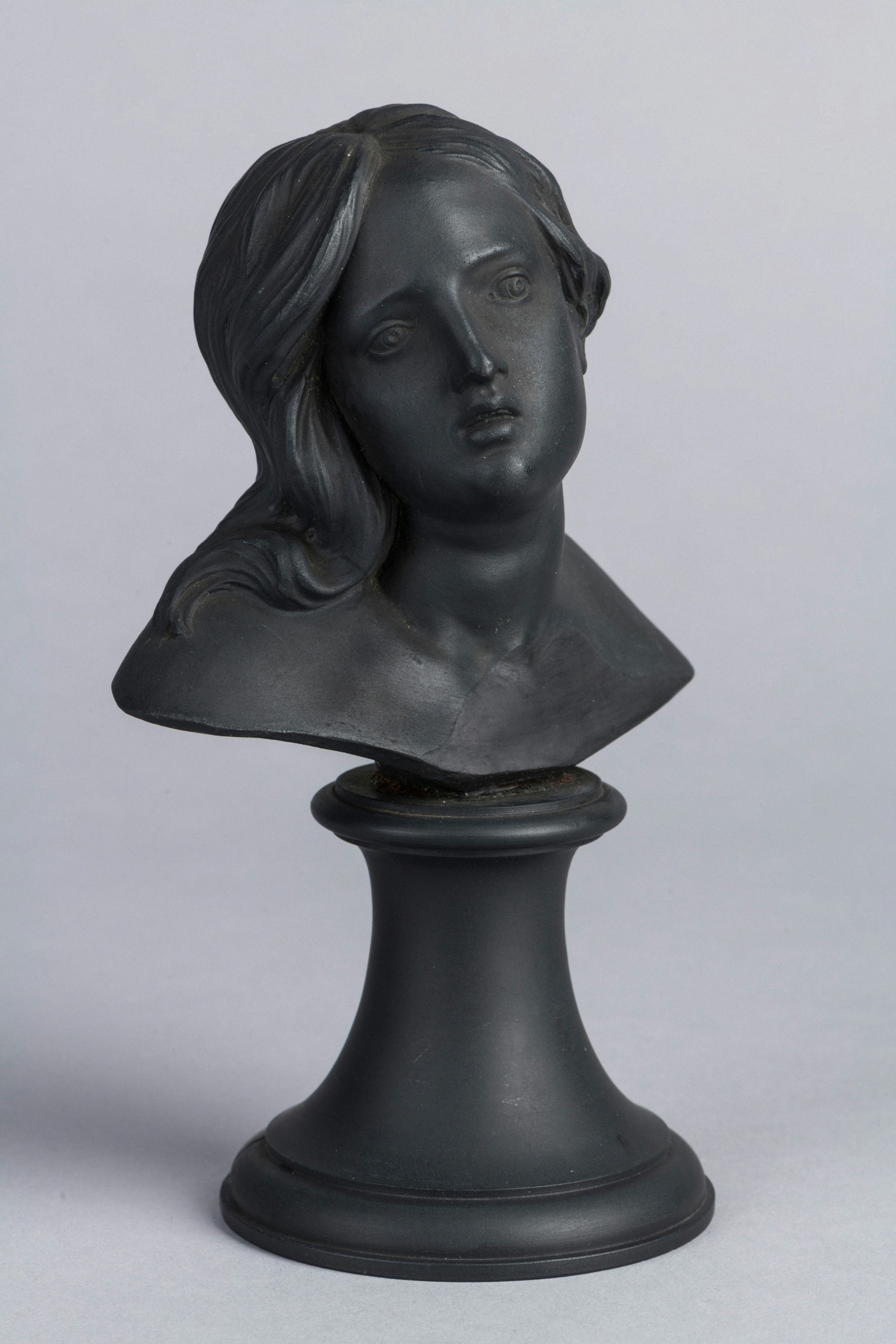 A dark sculpted bust of a woman's head and shoulders. photo – Free Art ...