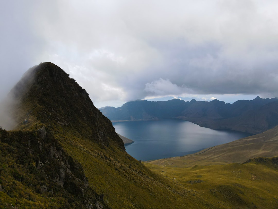 A mountain with a lake in the middle of it,