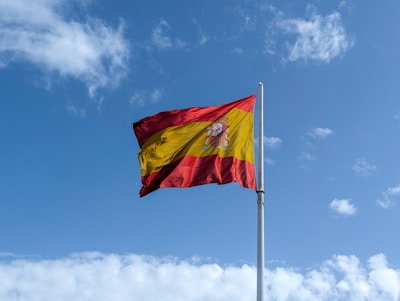 A flag flying in the wind on a sunny day