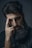 A man with a beard and a black shirt