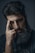 A man with a beard and a black shirt