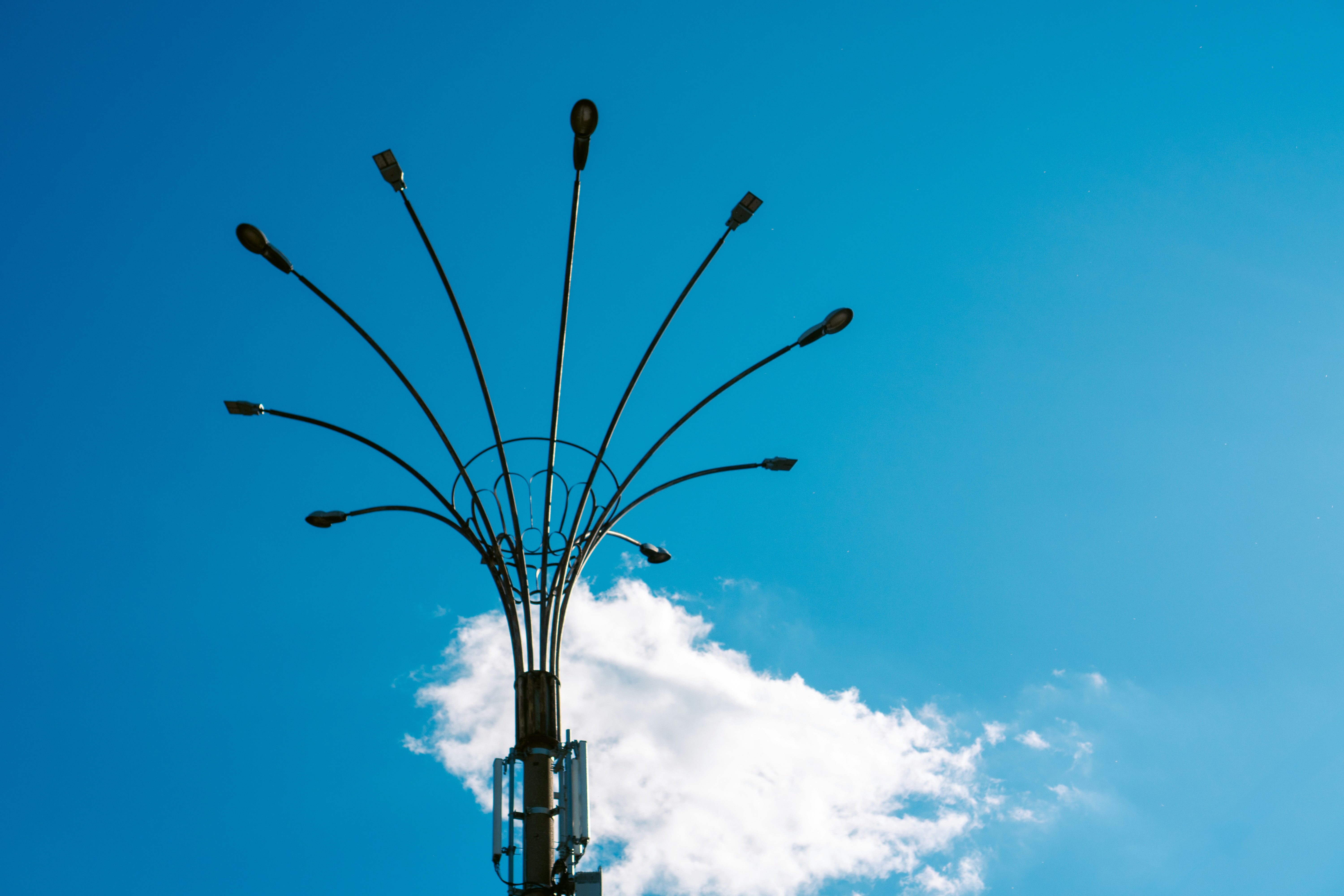 A street light with a blue sky in the background