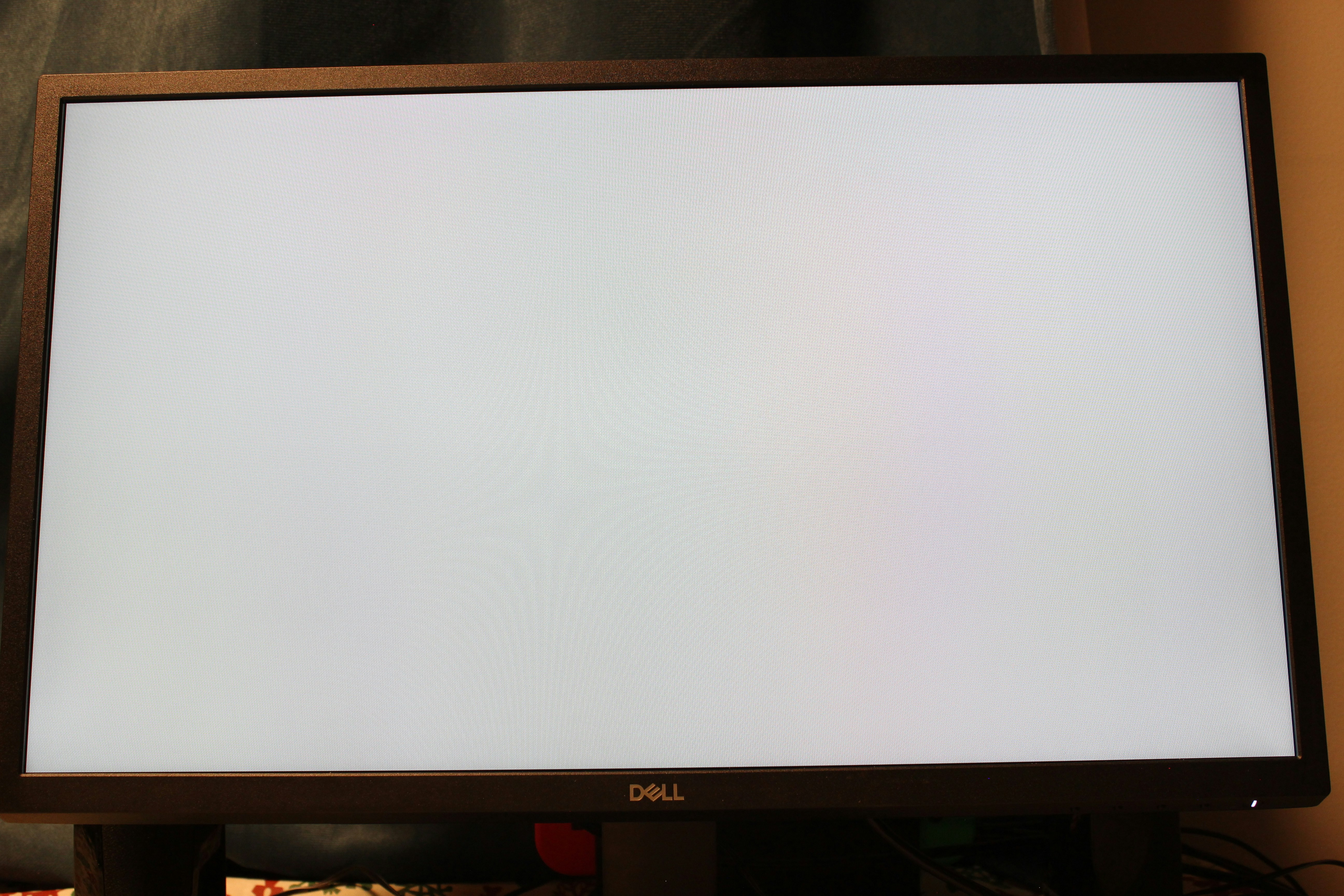 A big screen TV sitting on top of a wooden stand