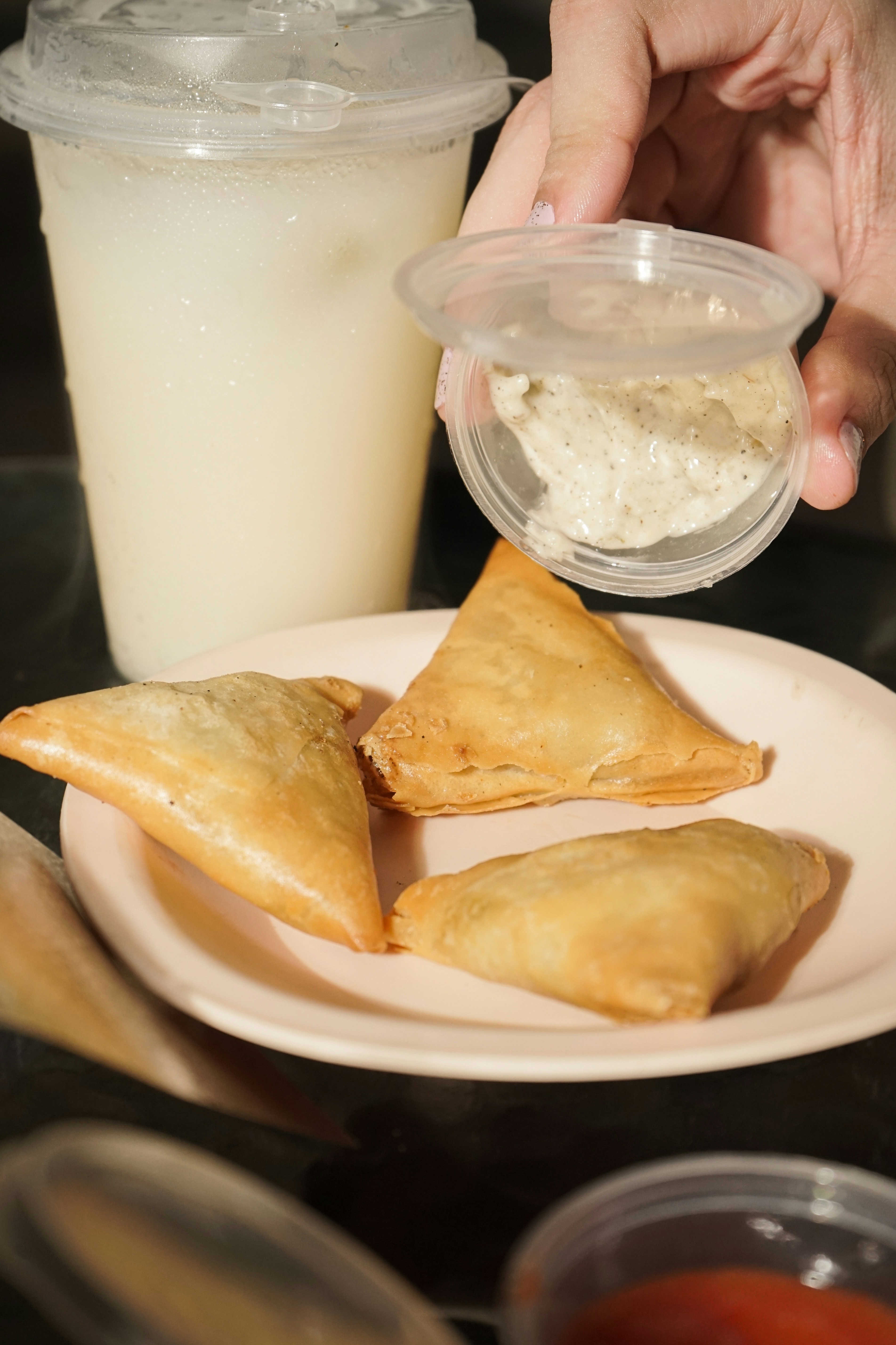 A plate of food and a drink on a table
