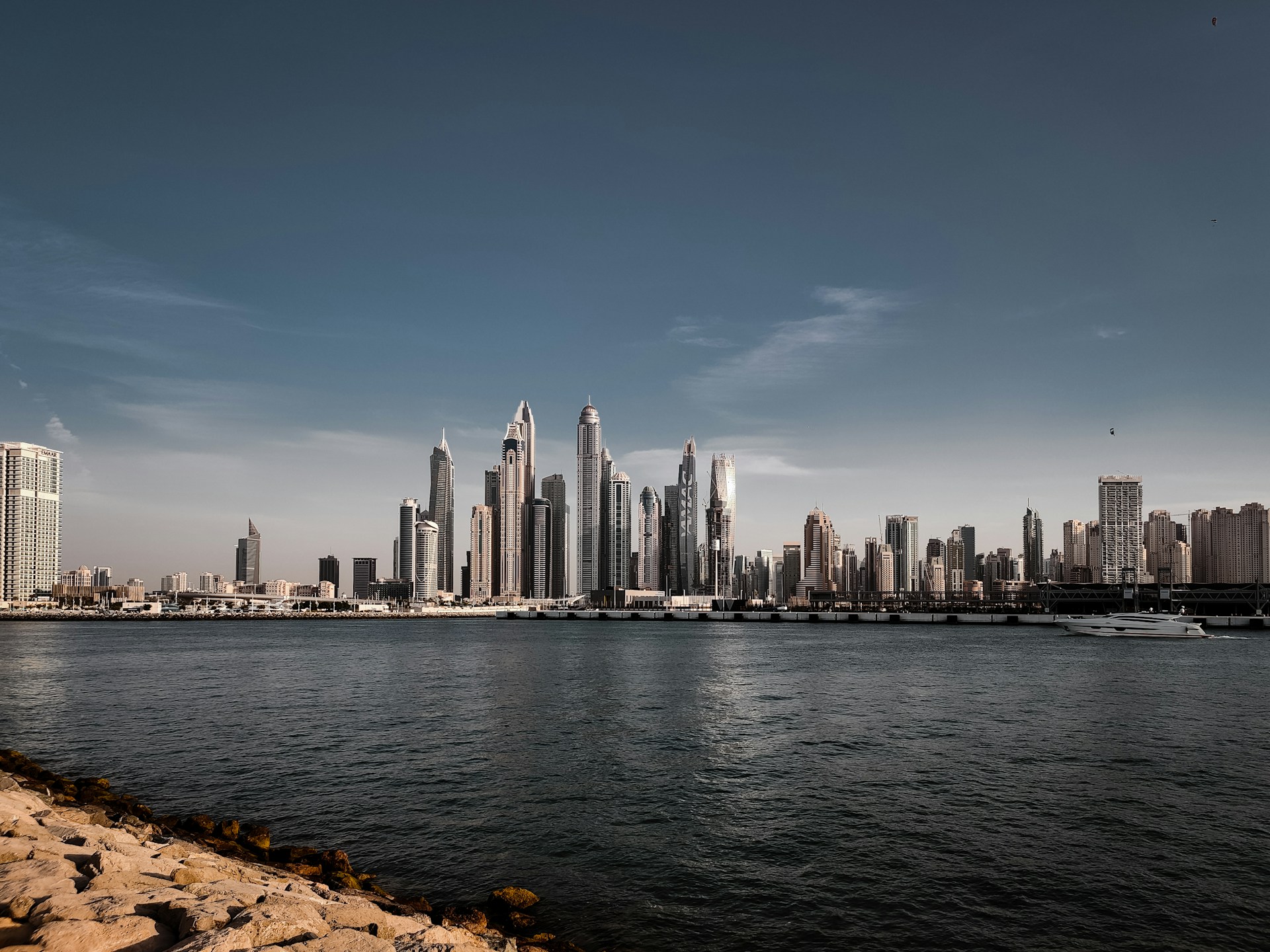 A large body of water with a city in the background