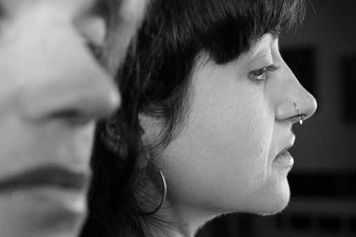 A black and white photo of a woman and a man