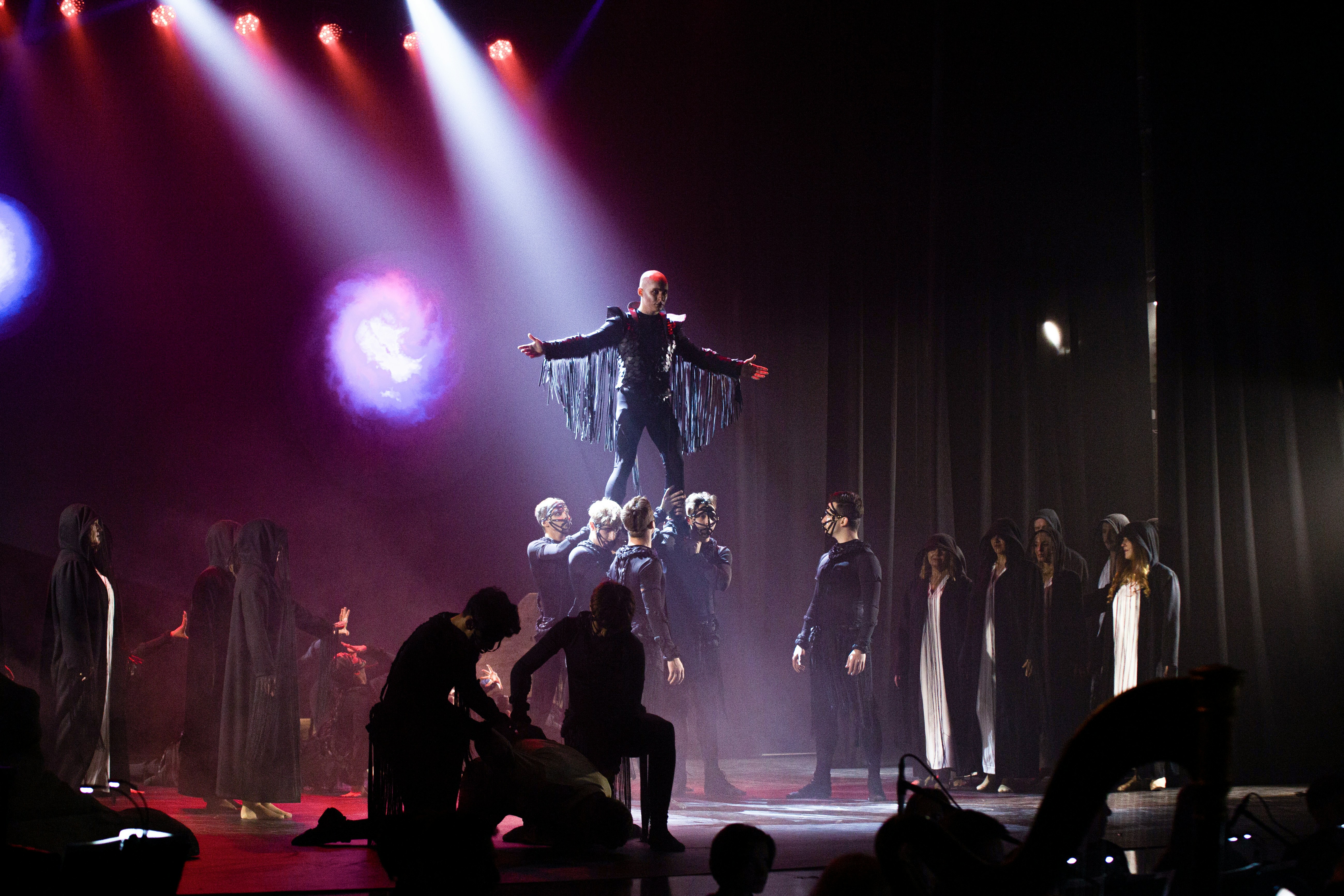 A group of people standing on top of a stage