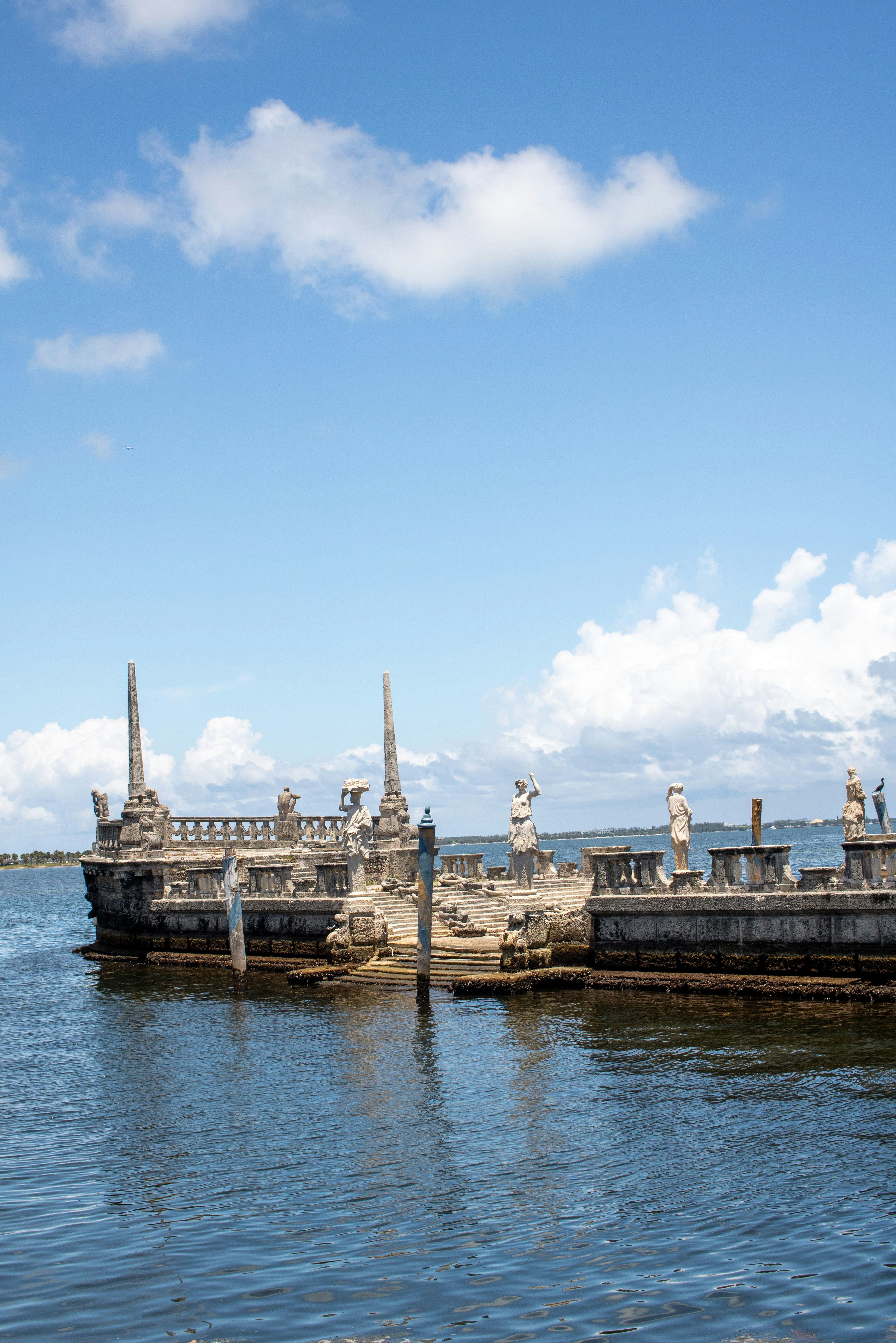 A large body of water with statues on it