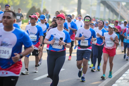 A large group of people running down a street
