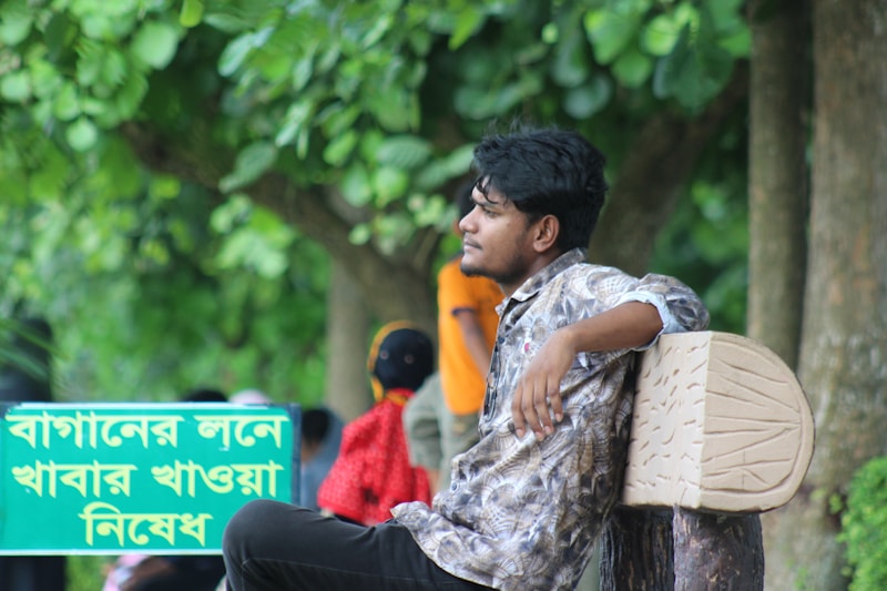 gay man sitting on bench