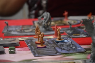 A close up of a board game with figurines on it