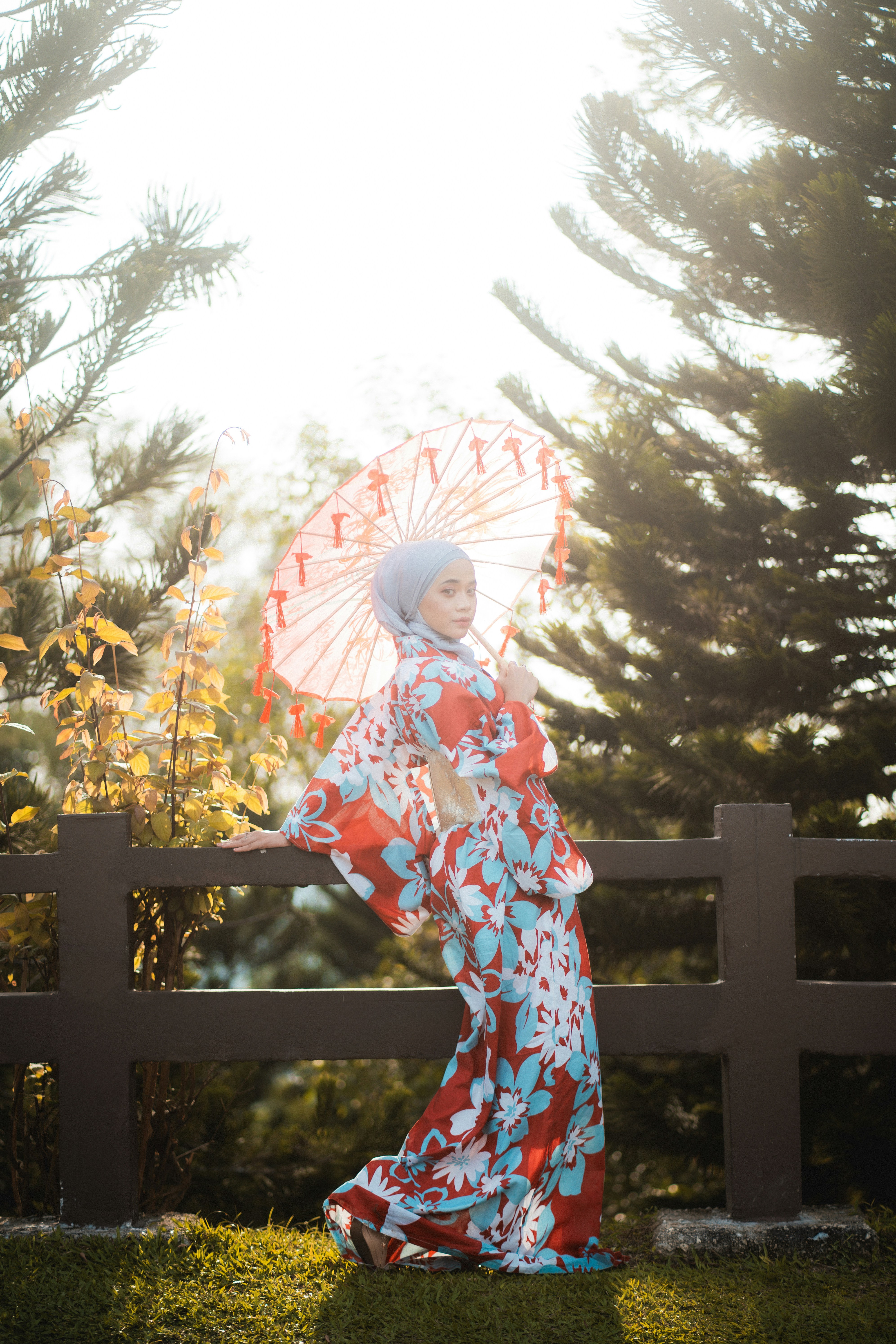 A woman in a kimono holding an umbrella
