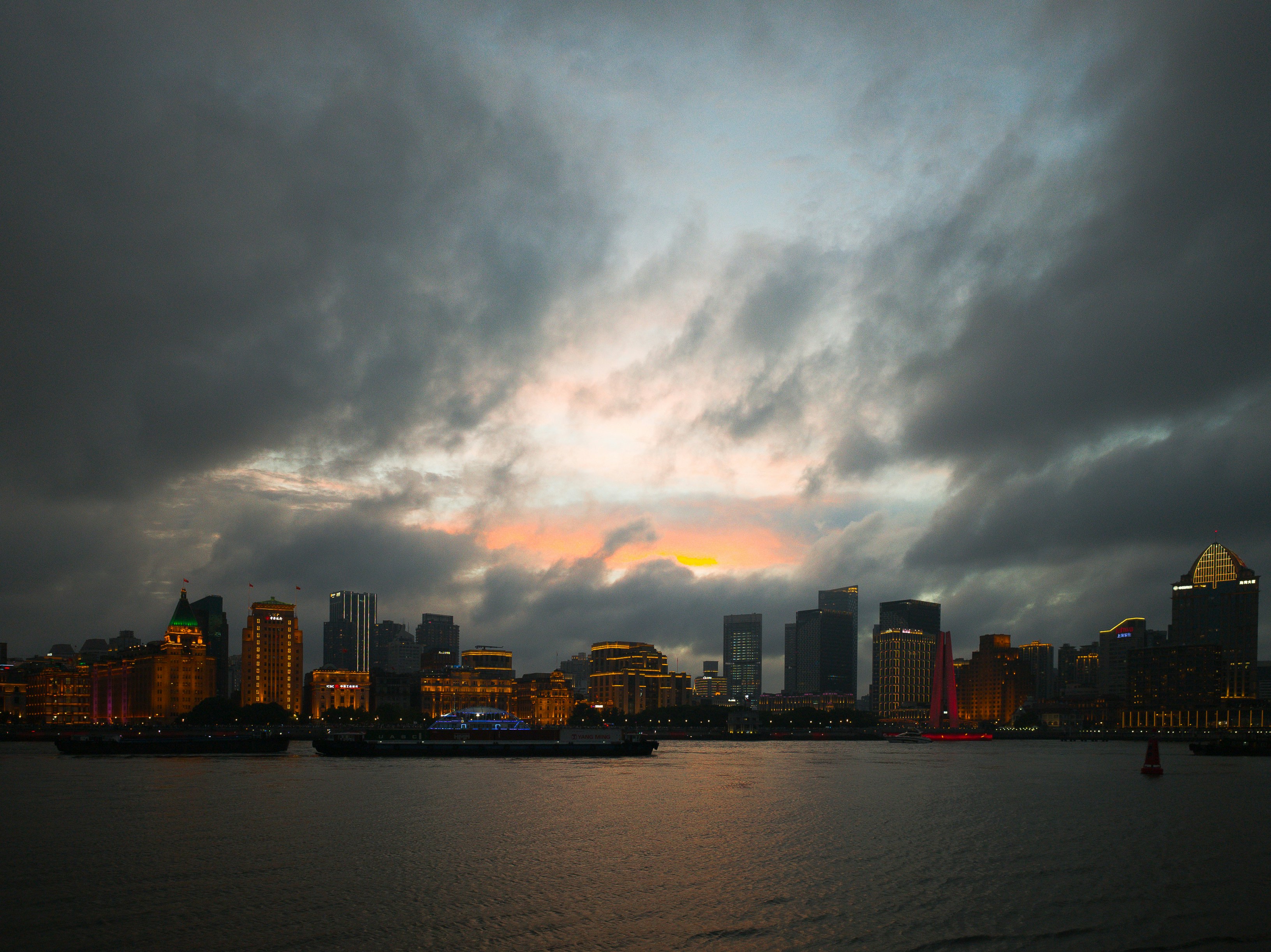 A large body of water with a city in the background