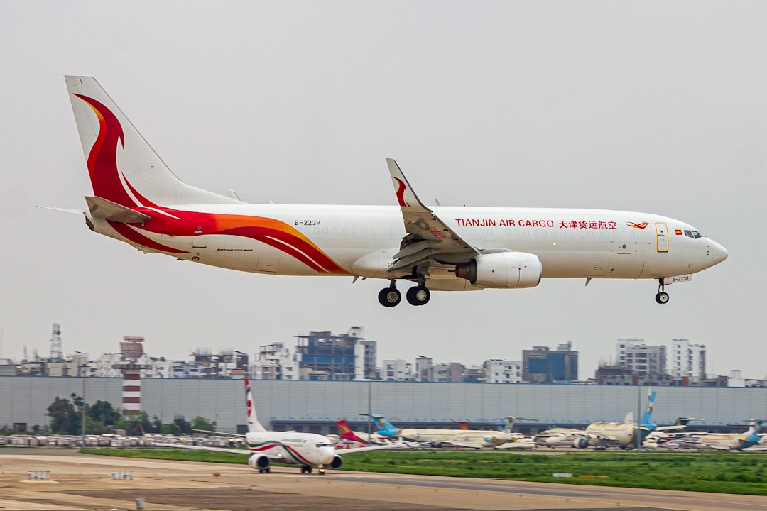 A large jetliner flying through a cloudy sky, DOUBLE BOEING 738 TIANJIAN AIR CARGO X BIMAN BANGLADESH 💥