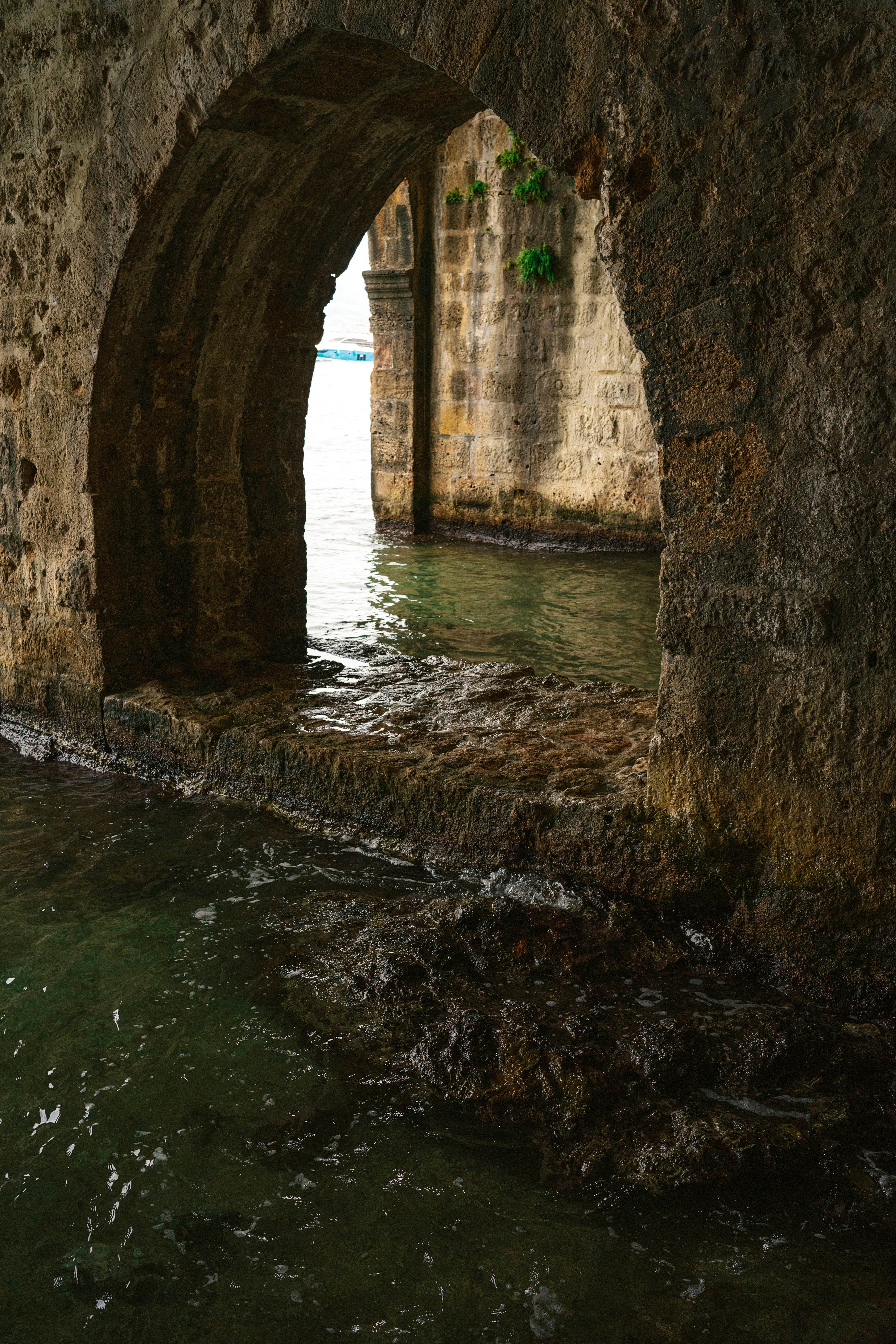 A stone bridge over a body of water