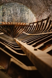 A wooden bench sitting inside of a tunnel