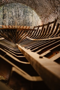 A wooden bench sitting inside of a tunnel
