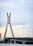 A very tall bridge over a large body of water