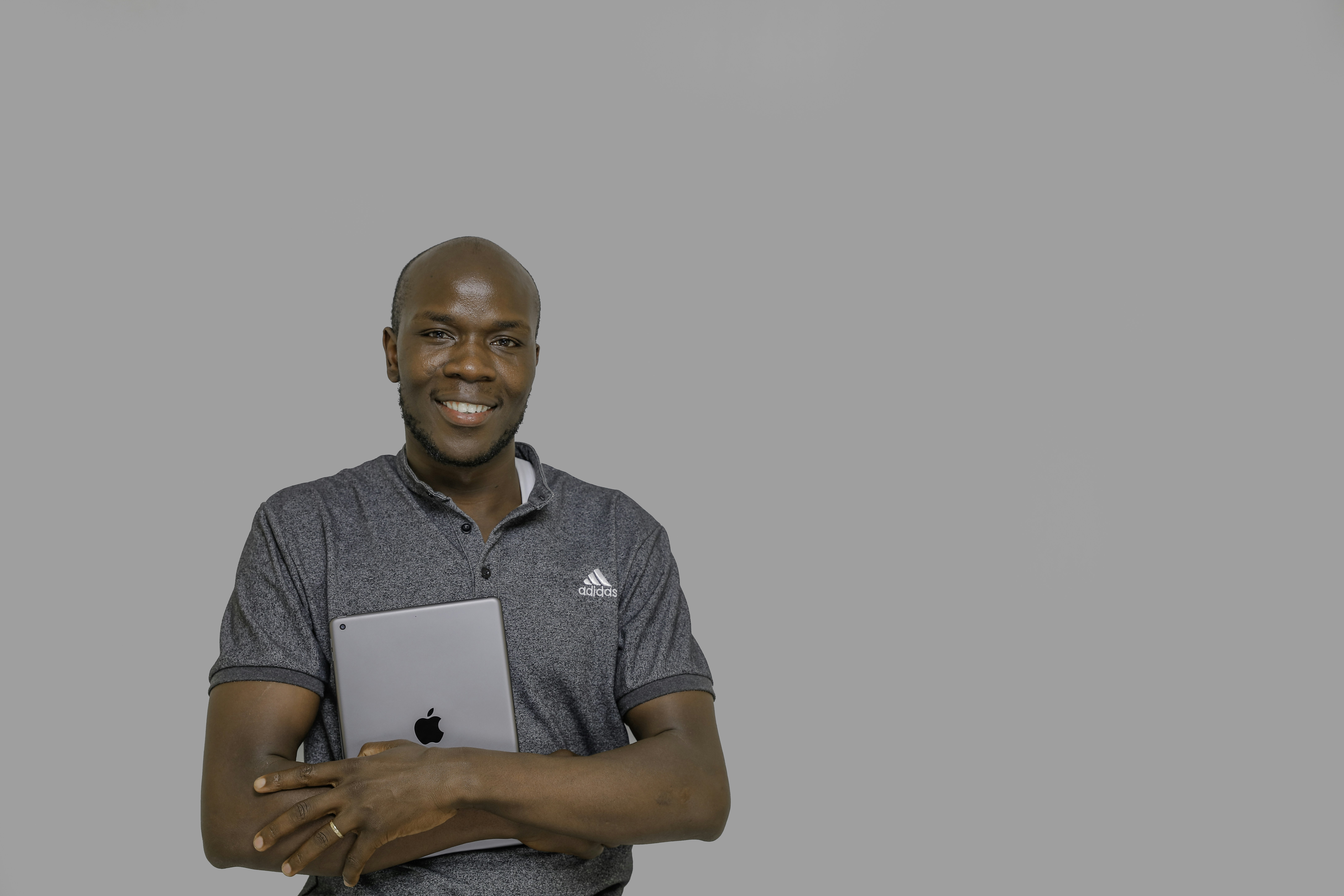 A man holding a laptop computer in his hands