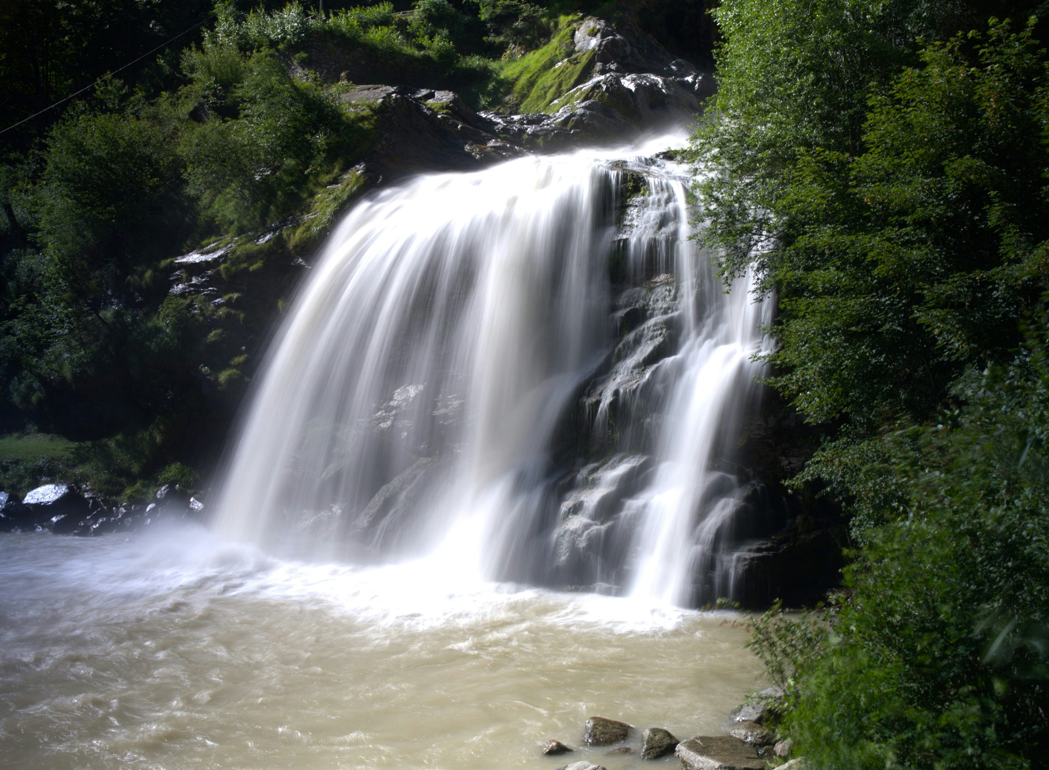 A large waterfall with lots of water coming out of it