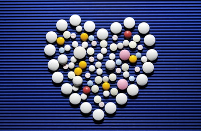 A heart made out of pills on a blue background
