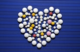 A heart made out of pills on a blue background