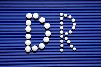 A blue sign with a bunch of white balls on it