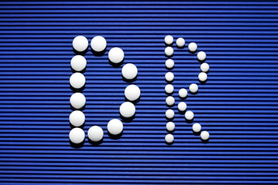 A blue sign with a bunch of white balls on it