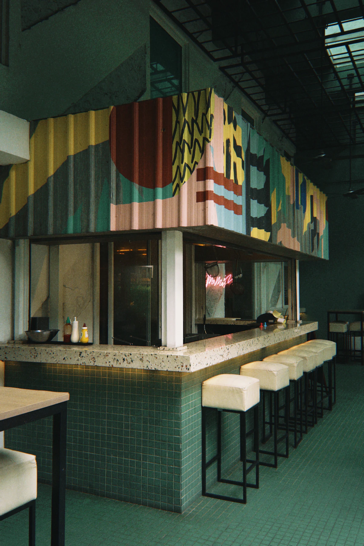 Restaurant interior with expressive wall mural