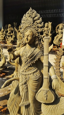 A statue of a woman holding a vase