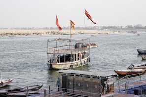 A boat floating on top of a body of water