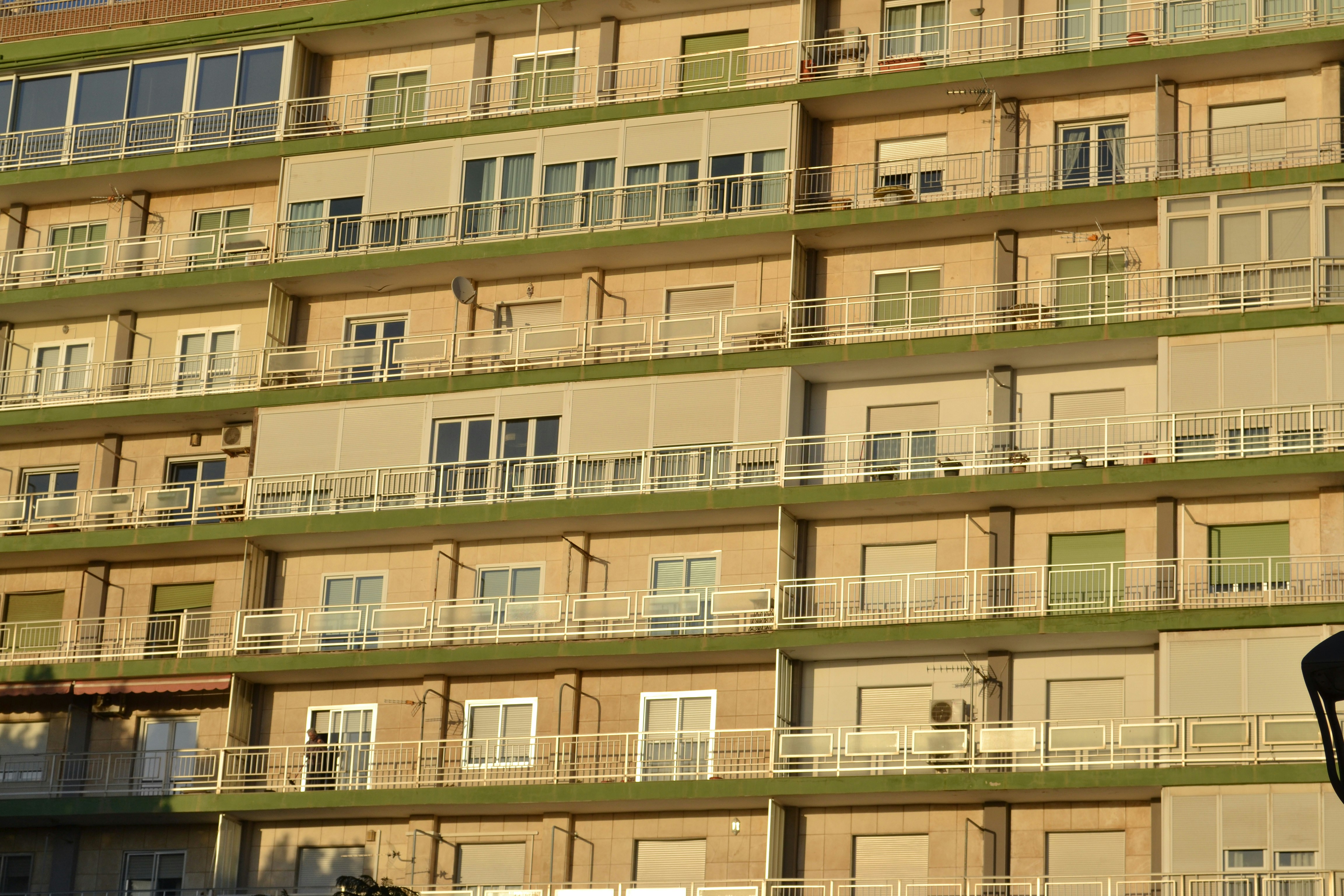 A tall building with balconies and balconies on it