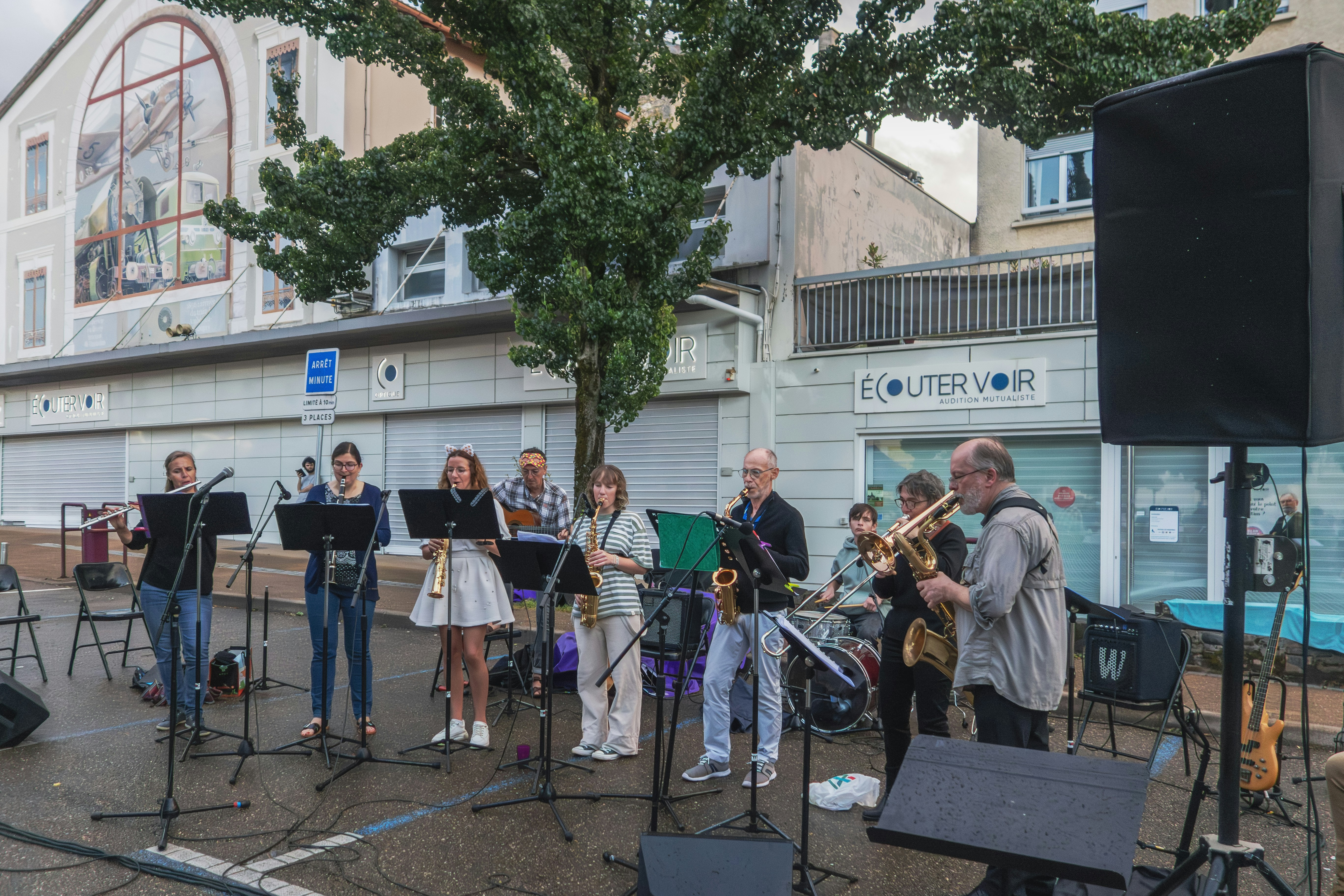 A group of people playing music on a street