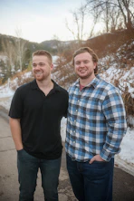 A couple of men standing next to each other