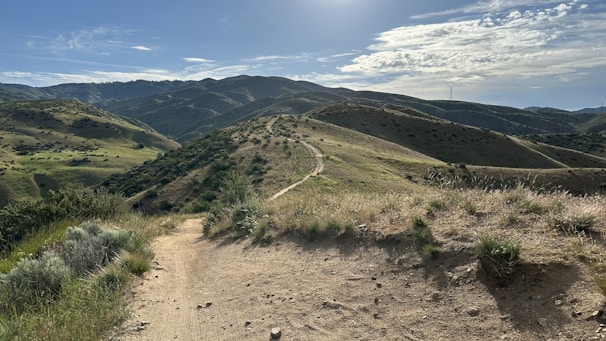 A dirt road in the middle of a mountain range