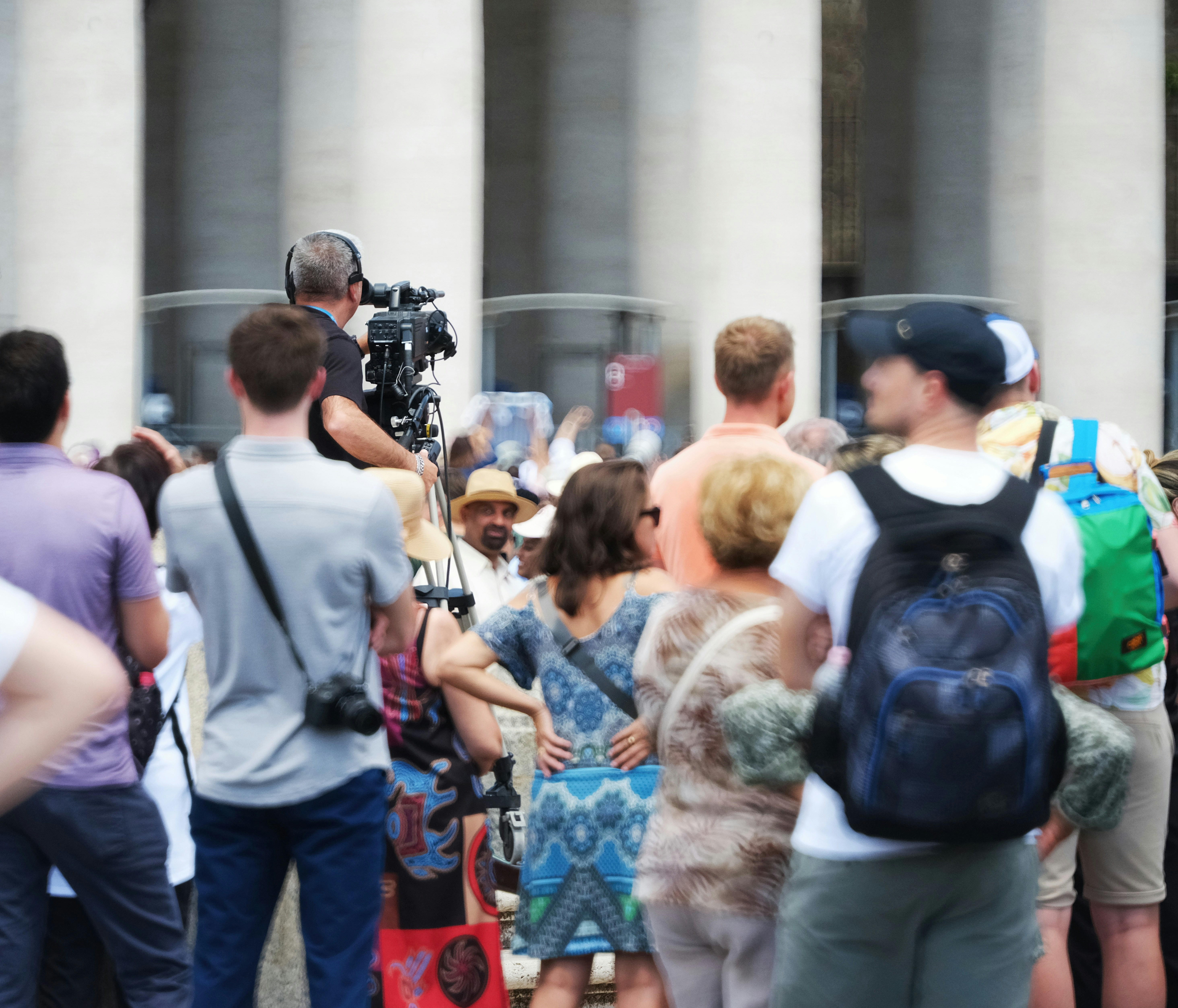 A group of people standing in front of a building