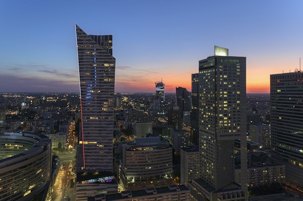 A view of a city at night from the top of a building — Warsaw, Poland