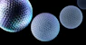 A group of three balls on a black background