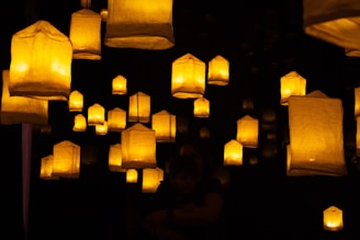 A group of paper lanterns floating in the air