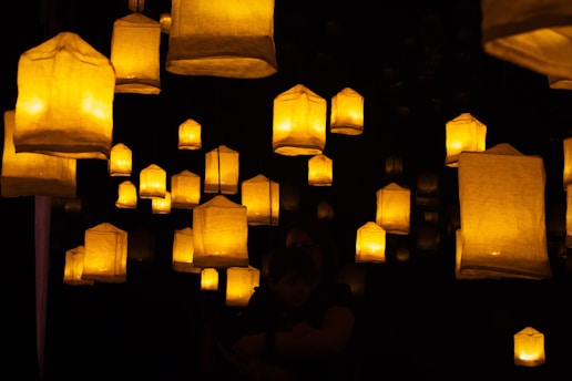 A group of paper lanterns floating in the air