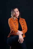 A woman sitting on a chair with her legs crossed